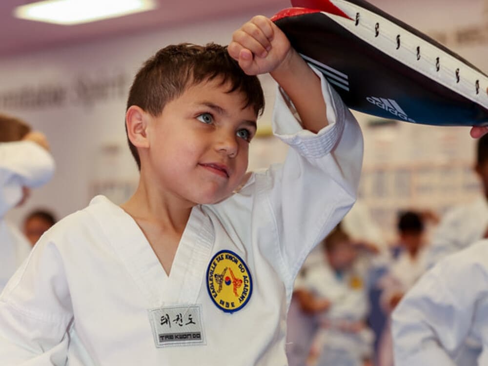 a kid taking his taekwondo class with joy in Norristown PA